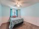 Cozy bedroom with carpet flooring, complemented by a ceiling fan and a window with soft lighting at 4063 S Cathay Ct, Aurora, CO 80013