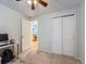 Cozy bedroom with a closet and natural light from a window. The floor is carpeted at 4063 S Cathay Ct, Aurora, CO 80013