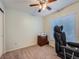 The bedroom features neutral paint, a ceiling fan, and carpet flooring at 4063 S Cathay Ct, Aurora, CO 80013