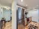 Modern kitchen featuring stainless steel appliances, wood cabinets, and granite countertops near the home's entry at 4063 S Cathay Ct, Aurora, CO 80013