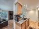 Charming kitchen features granite countertops, stainless steel appliances and breakfast bar seating at 4063 S Cathay Ct, Aurora, CO 80013