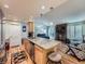 Bright, modern kitchen with granite counters, stainless steel appliances, and an adjoining living room area at 4063 S Cathay Ct, Aurora, CO 80013