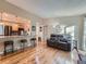 Open-concept living area with hardwood floors, kitchen views, and a comfortable seating area at 4063 S Cathay Ct, Aurora, CO 80013