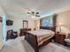 Comfortable main bedroom featuring plush carpeting, a ceiling fan, and matching furniture at 4063 S Cathay Ct, Aurora, CO 80013