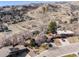 Aerial view of the property showcasing the house, surrounding neighborhood, and scenic mountain backdrop at 13640 W Center Dr, Lakewood, CO 80228