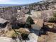 Aerial view of a single-Gathering home with a large yard, mature trees, and a spacious driveway at 13640 W Center Dr, Lakewood, CO 80228