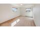 Well-lit bedroom with two windows, offering a bright and airy space for relaxation and rest at 13640 W Center Dr, Lakewood, CO 80228