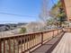 Expansive wooden deck offering stunning views of the surrounding landscape, ideal for outdoor living at 13640 W Center Dr, Lakewood, CO 80228