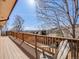 Inviting wooden deck with scenic views, perfect for enjoying the outdoors and relaxing in comfort at 13640 W Center Dr, Lakewood, CO 80228