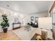 Inviting living room with bright white walls, stylish decor, and ample natural light at 13640 W Center Dr, Lakewood, CO 80228