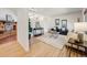 Bright and airy living room with hardwood floors, a cozy fireplace, and stylish decor at 13640 W Center Dr, Lakewood, CO 80228