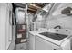 Laundry room with gray furnace and modern washer and dryer at 6864 Balsam St, Arvada, CO 80004