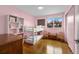 Bright ' bedroom featuring bunk beds, hardwood floors, and a sunny window at 6864 Balsam St, Arvada, CO 80004