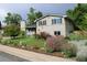 Beautiful two-story home showcasing lush landscaping and a well-maintained lawn at 6864 Balsam St, Arvada, CO 80004