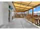 Back patio with a covered area and string lights; perfect for outdoor dining or relaxing at 6864 Balsam St, Arvada, CO 80004