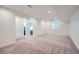 Spacious finished basement with neutral carpet, recessed lighting, and a window for natural light at 11270 E 26Th Ave, Aurora, CO 80010