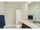 Clean bathroom featuring a shower/tub combination, a vanity with sink, and a toilet at 11270 E 26Th Ave, Aurora, CO 80010