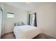 Minimal bedroom with small window and plush carpet at 11270 E 26Th Ave, Aurora, CO 80010