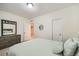 Bedroom with a matching dresser and mirror and comfortable bedding, neutral walls and carpet at 11270 E 26Th Ave, Aurora, CO 80010