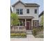 Charming two-story home boasts brick accents, a cozy front porch, and well-manicured landscaping at 11270 E 26Th Ave, Aurora, CO 80010