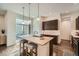 Contemporary kitchen featuring a large island, modern fixtures, and a seamless transition to the outdoor patio at 11270 E 26Th Ave, Aurora, CO 80010