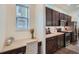 Desk space situated next to kitchen cabinets and stainless steel appliances at 11270 E 26Th Ave, Aurora, CO 80010