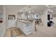 Finished basement bar area with granite counters, sink, microwave, and seating at 25 Summit Ash, Littleton, CO 80127