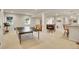 Spacious finished basement with ping pong table, seating, and bar area for entertaining at 25 Summit Ash, Littleton, CO 80127
