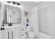 Stylish bathroom featuring modern fixtures, tiled shower, and sleek vanity with ample storage at 25 Summit Ash, Littleton, CO 80127