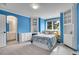 Bright bedroom with built-in shelving and colorful decor at 25 Summit Ash, Littleton, CO 80127