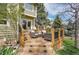 Backyard deck with comfortable seating and stairs leading to yard at 25 Summit Ash, Littleton, CO 80127