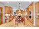 Gourmet kitchen with custom wood cabinets, a large island, and stainless steel appliances at 25 Summit Ash, Littleton, CO 80127