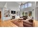 Spacious living room featuring a fireplace, built-in shelving, and an abundance of natural light at 25 Summit Ash, Littleton, CO 80127