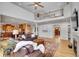Open-concept living room showcasing a seamless transition to the kitchen, hardwood floors and a fireplace at 25 Summit Ash, Littleton, CO 80127