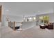 Open loft space with a telescope, seating area, and natural light at 25 Summit Ash, Littleton, CO 80127