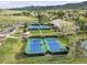 Aerial view of well-maintained tennis courts within a community, perfect for active recreation at 25 Summit Ash, Littleton, CO 80127