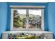 Bright view of a home and mountains from a bedroom window at 25 Summit Ash, Littleton, CO 80127