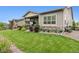 Expansive backyard with lush green lawn, patio area, and serene outdoor setting at 22065 E Bailey Pl, Aurora, CO 80016