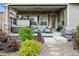 Relaxing outdoor space featuring a hot tub, seating area, and well-kept landscaping at 22065 E Bailey Pl, Aurora, CO 80016