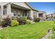 Picturesque backyard with a well-manicured lawn, patio, and inviting outdoor living space at 22065 E Bailey Pl, Aurora, CO 80016
