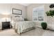 Comfortable bedroom with natural light, plush carpet, and stylish furniture at 22065 E Bailey Pl, Aurora, CO 80016