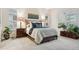 Comfortable bedroom with shuttered windows, a bed with a padded headboard, and bedside lamps at 22065 E Bailey Pl, Aurora, CO 80016
