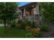 Charming home exterior featuring stone accents, manicured landscaping, and covered porch at 22065 E Bailey Pl, Aurora, CO 80016