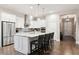 Bright kitchen with white cabinets, stainless steel appliances and spacious island at 22065 E Bailey Pl, Aurora, CO 80016