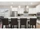 Modern kitchen with stainless steel appliances, pendant lighting, and breakfast bar at 22065 E Bailey Pl, Aurora, CO 80016