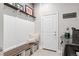 Inviting mudroom with a bench, storage, and easy access to laundry at 22065 E Bailey Pl, Aurora, CO 80016