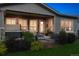 Relaxing outdoor patio with a hot tub, stone accents, and comfortable seating, perfect for entertaining at 22065 E Bailey Pl, Aurora, CO 80016