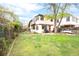 Lush backyard featuring a beautiful lawn and outdoor seating at 1220 S Vine St, Denver, CO 80210