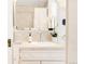 Clean bathroom featuring modern fixtures, a stylish mirror, and decorative accents at 1220 S Vine St, Denver, CO 80210