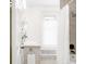 Bright bathroom featuring white vanity and cabinets, a shower curtain, and natural light at 1220 S Vine St, Denver, CO 80210